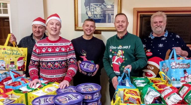 Staff play Santa as care leavers gather for their big Christmas treat